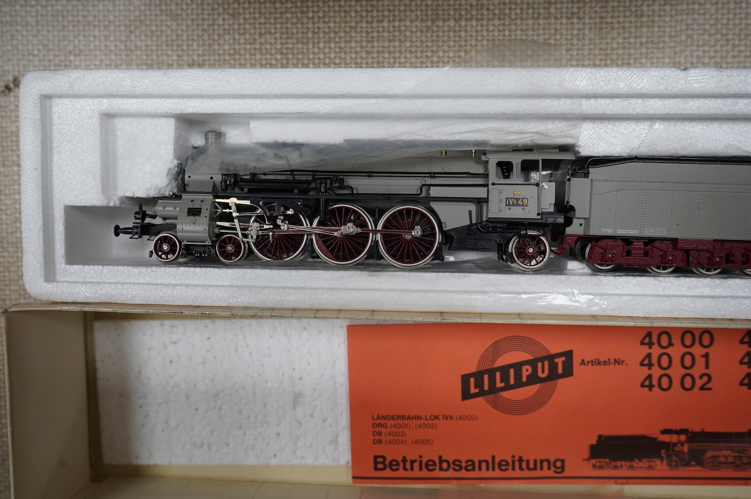 Two boxed Fleischmann HO gauge German passenger train sets, both comprising of a tender locomotive and bogie coaches (4885 and 4894), together with a Liliput 4-6-2 locomotive (4001) and a DR Rhinegold coach set (820), (4